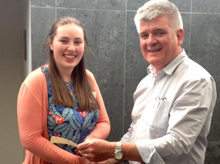 Lisa Kelly receives a prize from Centre director Chris Gregory