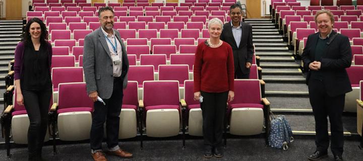 Members of the MS Centre leadership team standing at the front of an auditorium