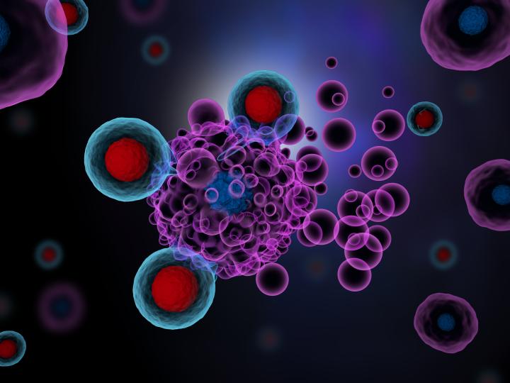 A 3D render of T cells attacking cancer cells