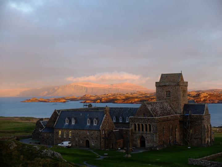 Photograph of Iona Abbey, in the distance are the hills on the Isle of Mull. 