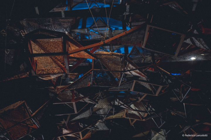 Metal beams hanging from the ceiling. Taken at Venice Biennale. 