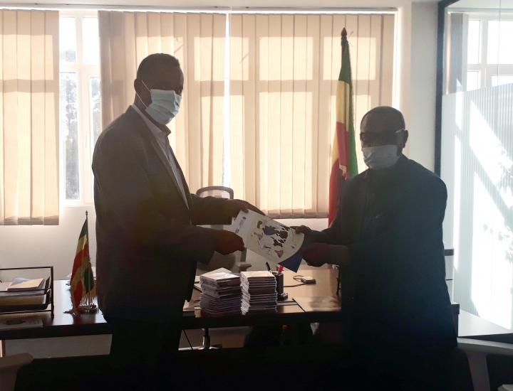 Minister of State for Livestock Development of Ethiopia's Ministry of Agriculture receives the Mastitis training materials
