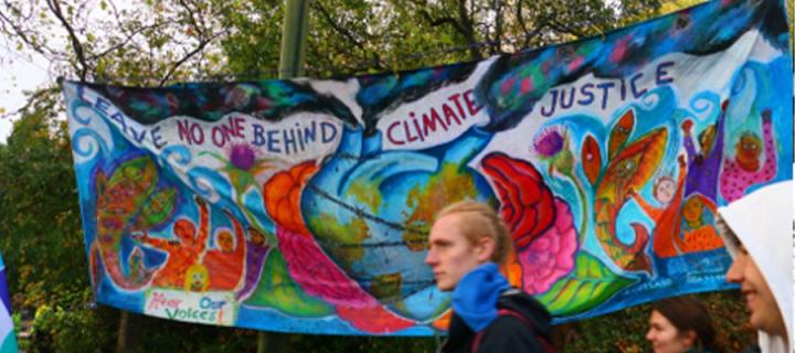 Colourful banner at COP26 march
