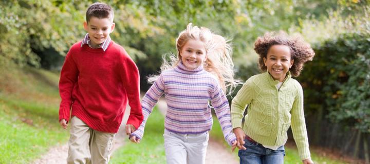 Three children playing outside