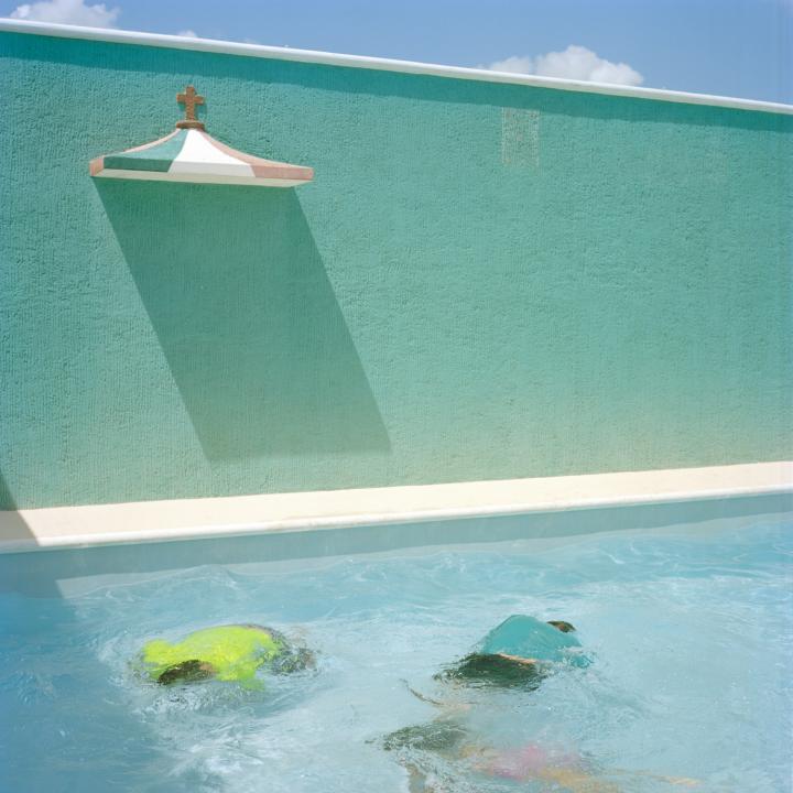 Young Korean-Mayans play around in the pool at the 90th birthday party of a second-generation relative. Merida, Mexico. 2016.