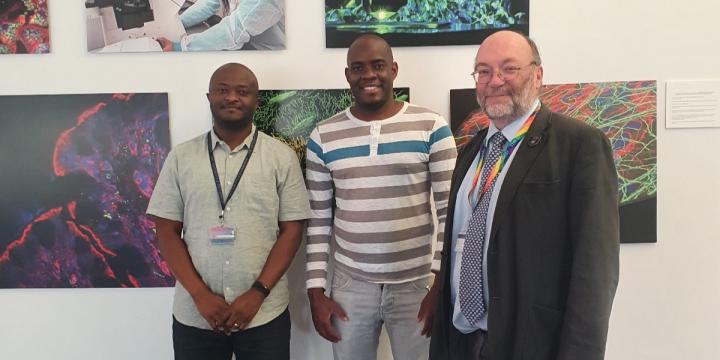 Dr. Mitambo with Prof. Bruce Whitelaw, Director of The Roslin Institute, and Dr. Adrian Muwonge, co-director of the Fleming Fund at the University of Edinburgh, exchanging valuable knowledge