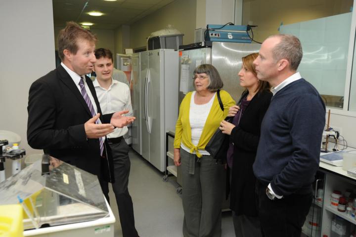 Professor Charlie Gourley with the family of Nicola Murray at the ovarian cancer research centre