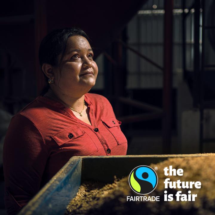 Woman looking into the distance with Fairtrade logo and text The Future is Fair