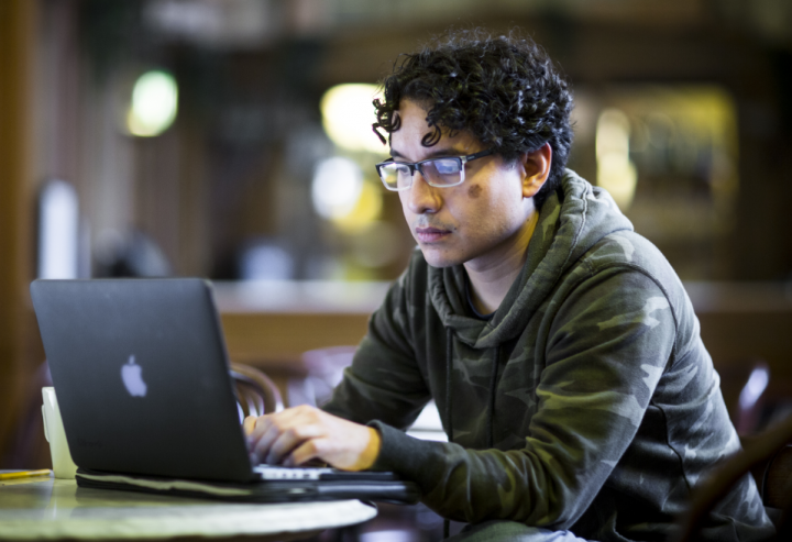 online learning student sat at laptop