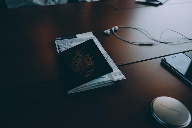 Passport and headphones on table