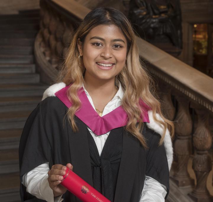 Current student Simran Piya accepting a degree on behalf of the Edinburgh Seven. 