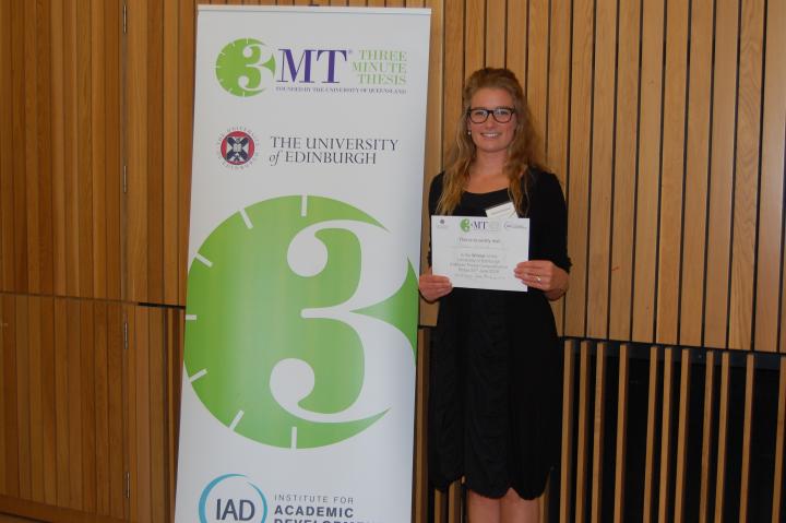 Phoebe Kirkwood receiving her prize for the three minute thesis competition