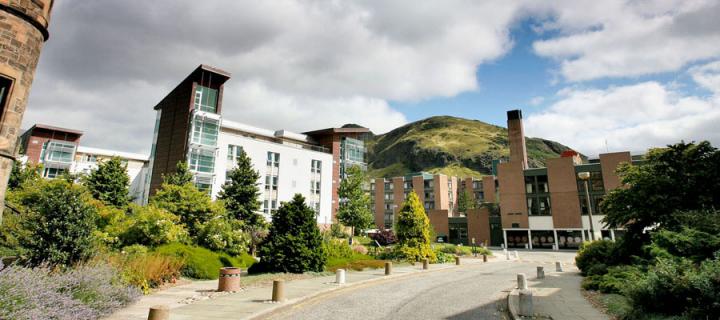 Pollock Halls against the backdrop of Holyrood Park hills