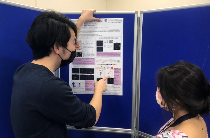 MScR student Jacky Tam presenting his poster during College poster day in March 2022