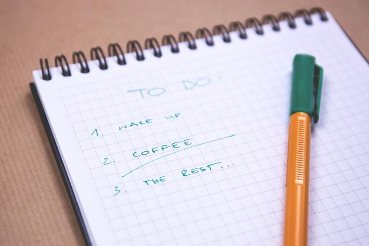 A to do list written in pen, with the tasks. 1. Wake up 2. Coffee. 3. The Rest...
