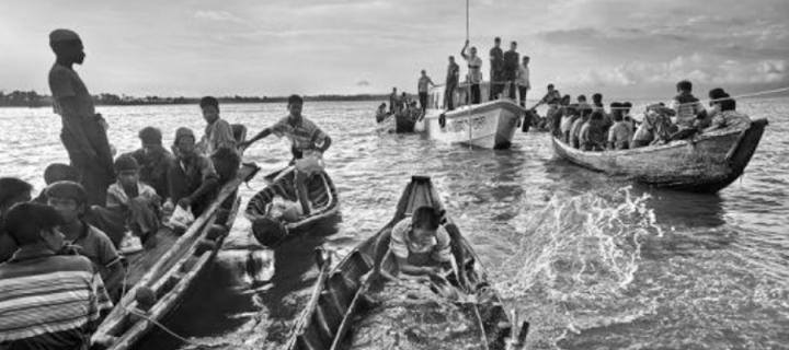Refugees travelling by boat