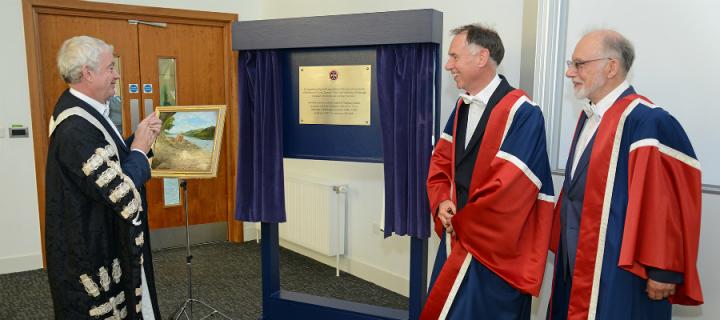 Principal unveils a plaque dedicated to the Robert O Curle Charitable Trust