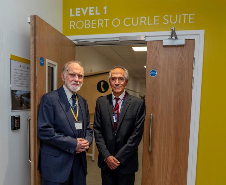 Alastair Maclean and Dr Baljean Dhillon in front of the ROC suite.