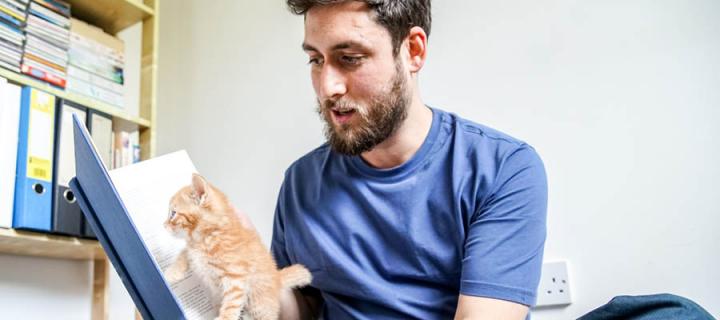 UK Pet Poet Laureate 2018-19 Russell Jones reads to a kitten.