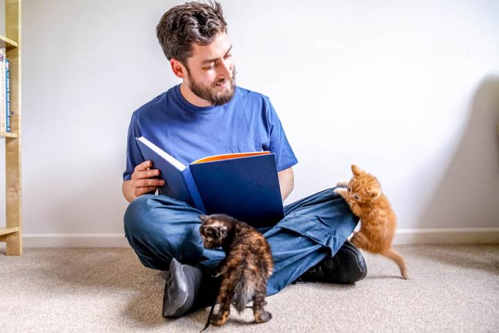 UK Pet Poet Laureate 2018-19 Russell Jones reads to a kitten.