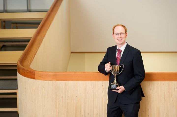 Sandy holding the University of Edinburgh Innovation Cup