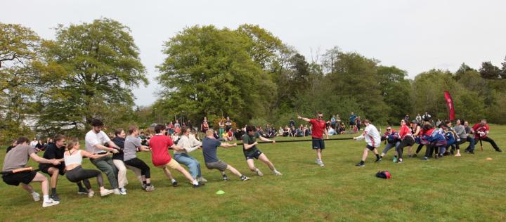 two teams compete in a tug o war
