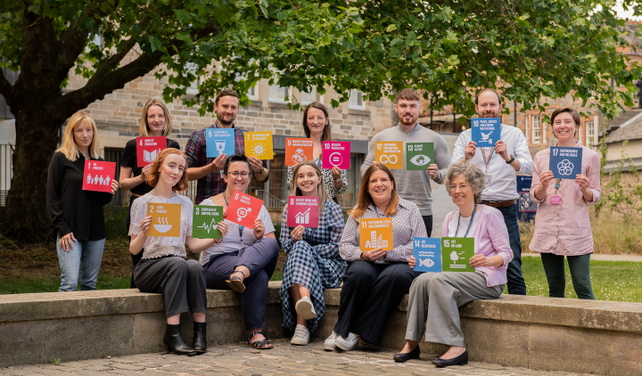 The Department for Social Responsibility and Sustainability staff photo Summer 2022 with SDGs