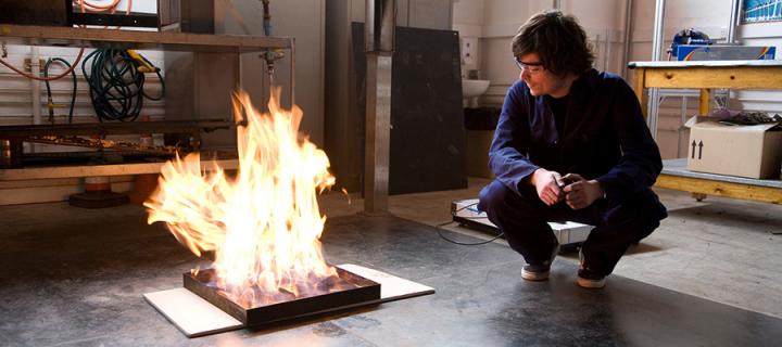 Student conducting a fire safety engineering experiment