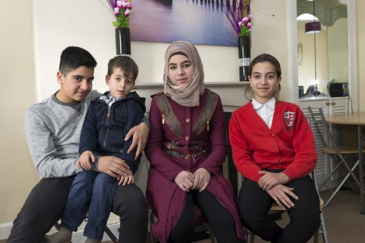 Photograph of the Al Dabbas siblings (left-to-right), Malek, 14, Yamen, 5, Israa, 16, and Shaimaa, 11, at their new home in Musselburgh, near Edinburgh. 