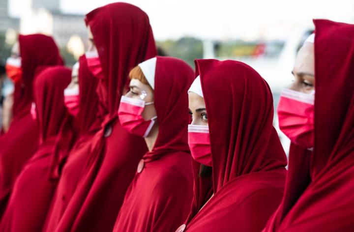 People in Turkey demonstrate wearing costumes from the TV series ‘ A Handmaid’s Tale’ and red face masks