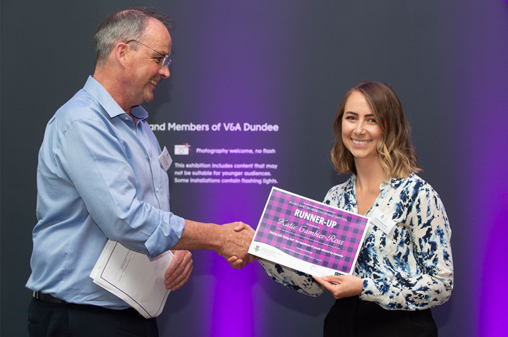 Katie accepting her award from Professor John Rowan, University of Dundee