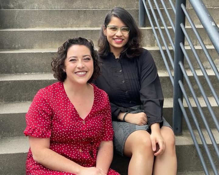 Olivia, Poetry Editor-in-Chief, and Vidisha, Prose Editor-in-Chief siting on stairs