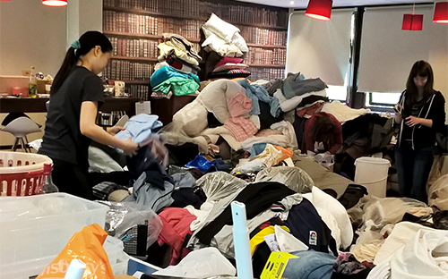 Volunteers sorting through items