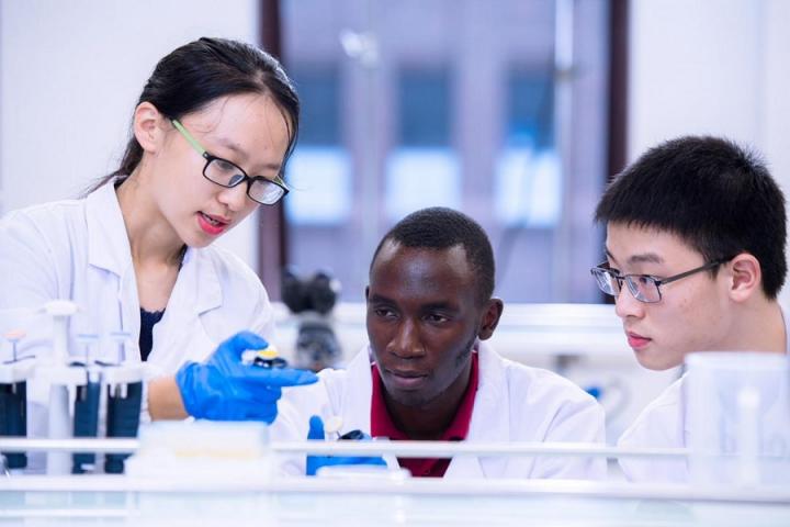 Three students in a lab in Zhejiang, China