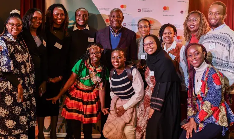 A group of people at the Mastercard Foundation event pose for a picture. 