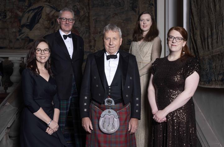 Image of the Principal and Vice-chancellor at the awards ceremony with the winners