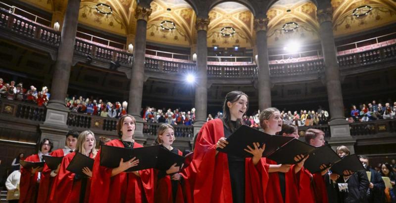 Carol singers singing at Christmas Carol Service