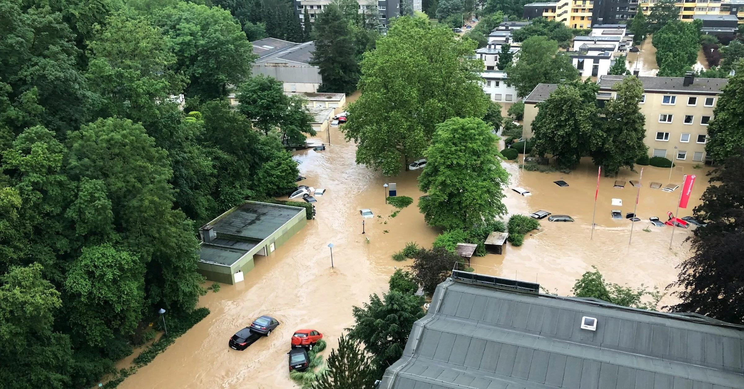 Aerial image of cars floating in flooded city streets