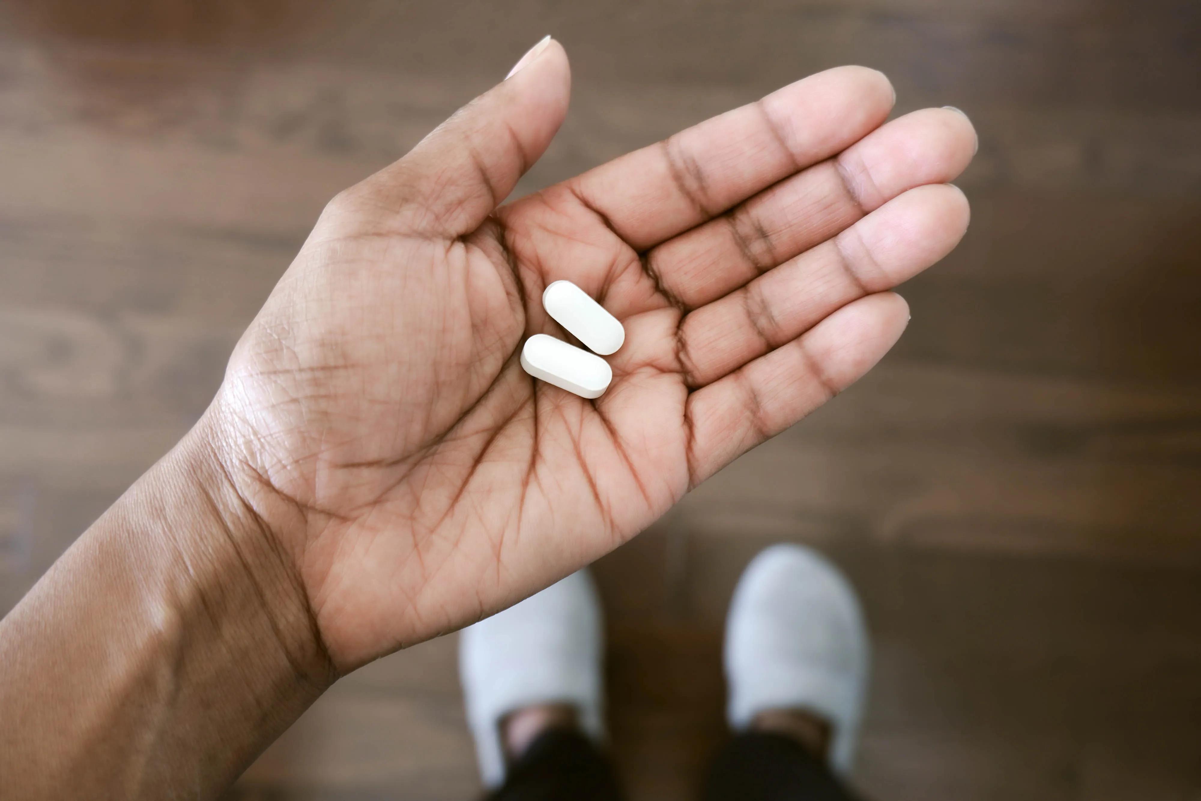 Hand holding tablets 