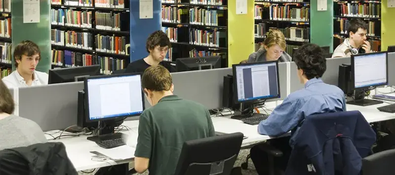 Photo of students using computers in the Main Library