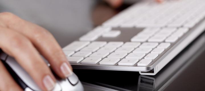 Hands on Apple keyboard and mouse