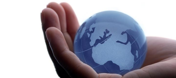 Globe cupped in palm of hand