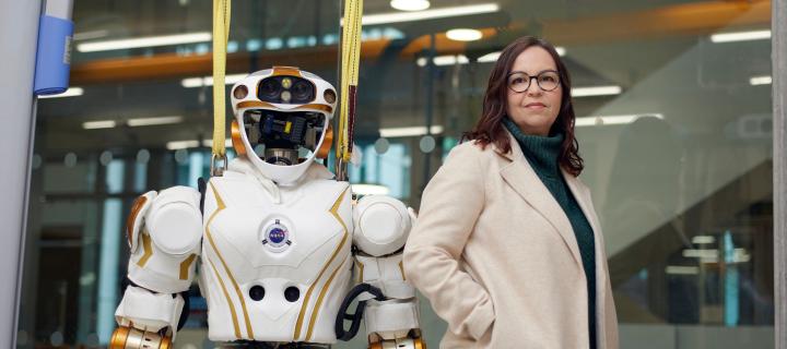 Image of Professor Shannon Vallor with a robot