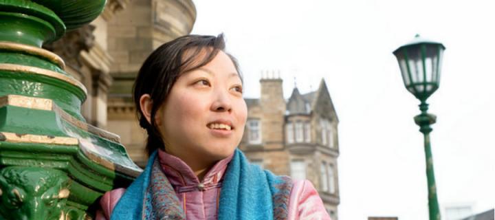 A scholarship student outside McEwan Hall