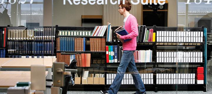 Student walking in the library