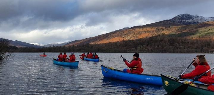 People in canoes on loch Tay