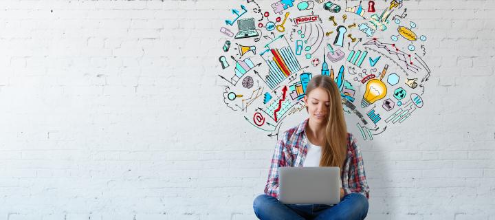 Person on laptop, leaning against a wall with and illustration of ideas behind her. 