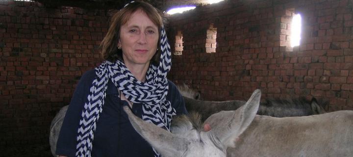 Alex Thiemann next to a donkey in Spain