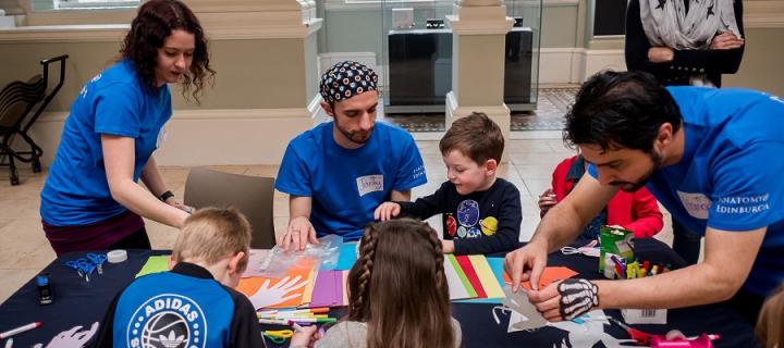 Anatomy student volunteers working with children at the Science Saturday at the Museum