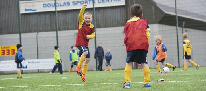 boys playing football